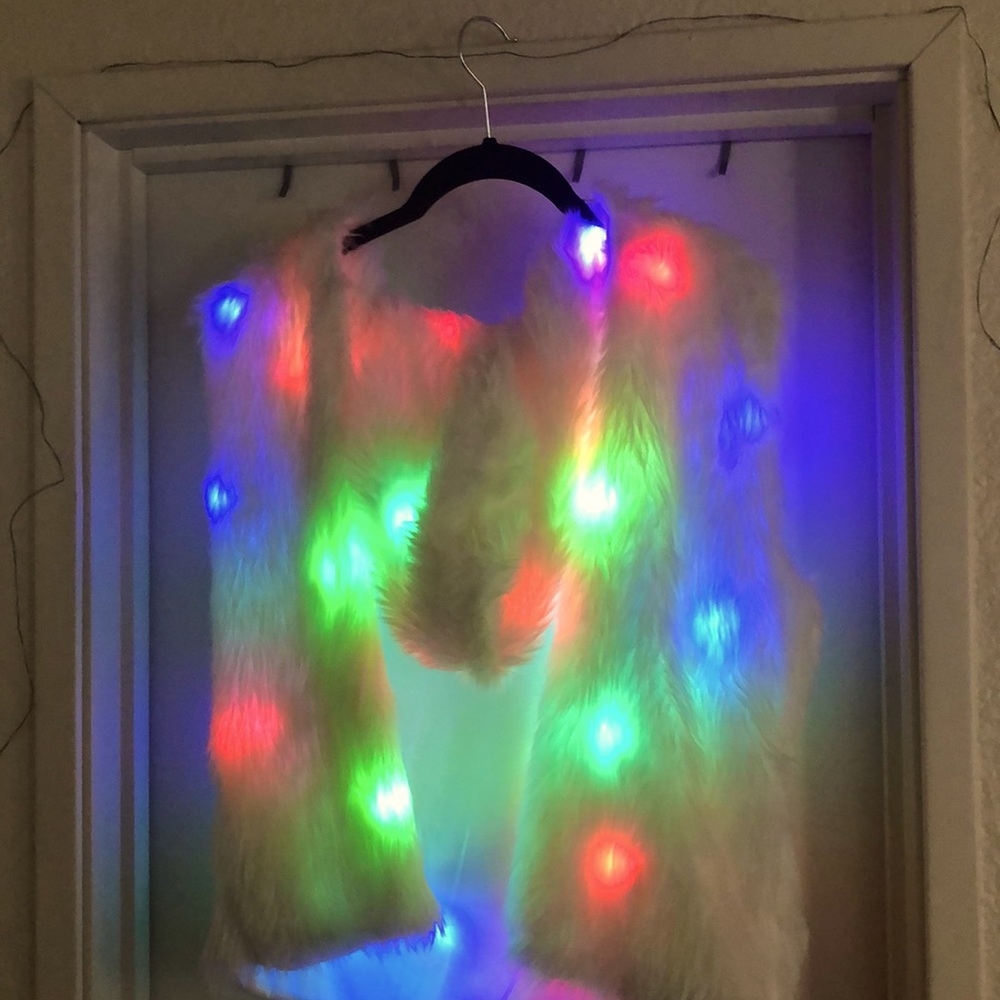Sleeveless light-up furry vest. From Spencer’s